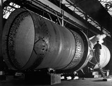 A rotary kiln section being welded in preparation for installation, Steetley, Nottinghamshire, 1962. Creator: Michael Walters