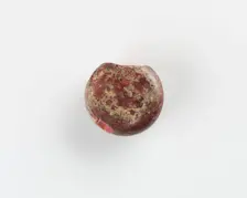 A round marker for games. Chipped, Roman period, (3rd-4th century?). Creator: Unknown