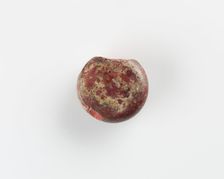 A round marker for games. Chipped, Roman period, (3rd-4th century?). Creator: Unknown