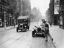 A Rover 1928 10/25 HP sports car parked in a London street, 1931