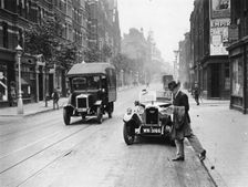A Rover 1928 10/25 HP sports car parked in a London street, 1931