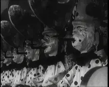 A Row of Clown Figures With Balloons Forming Part of a Game, 1924. Creator: British Pathe Ltd