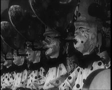A Row of Clown Figures With Balloons Forming Part of a Game, 1924. Creator: British Pathe Ltd