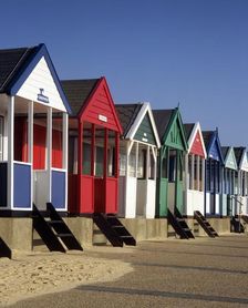 A row of eight colourful beach huts, Southwold, Suffolk, c2000s(?)