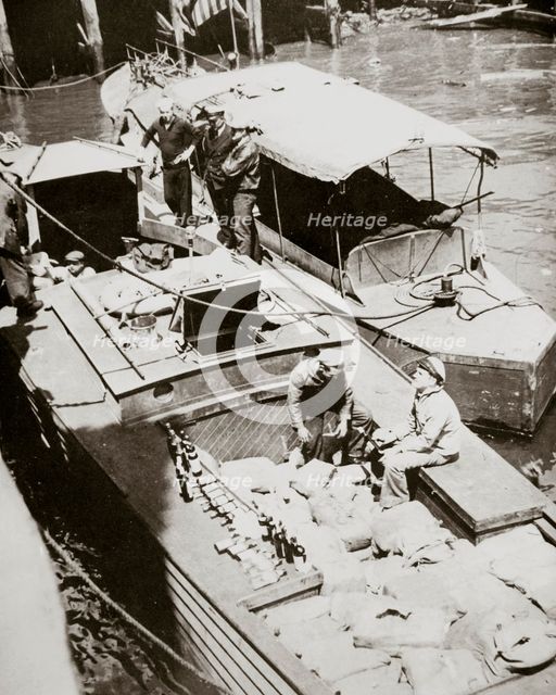 A rum-running boat caught smuggling in 2000 bottles, USA, 1920s.  Creator: Unknown.