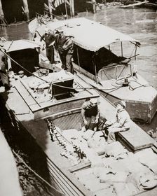 A rum-running boat caught smuggling in 2000 bottles, USA, 1920s. Creator: Unknown