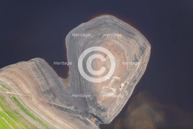 A ruined building revealed by low water levels at Howden Reservoir, Derbyshire, 2022. Creator: Emma Trevarthen.
