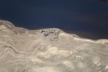 A ruined building revealed by low water levels at Ladybower Reservoir, Derbyshire, 2022. Creator: Emma Trevarthen