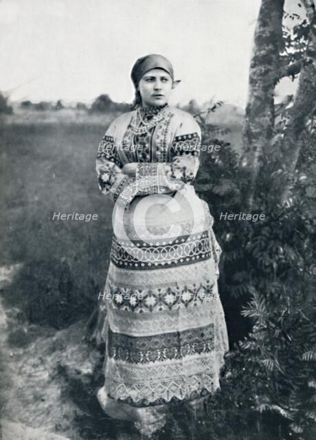 A Russian peasant in costume, 1912. Artist: Unknown.