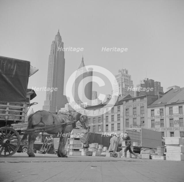 A scene at the Fulton fish market, New York, 1943. Creator: Gordon Parks.
