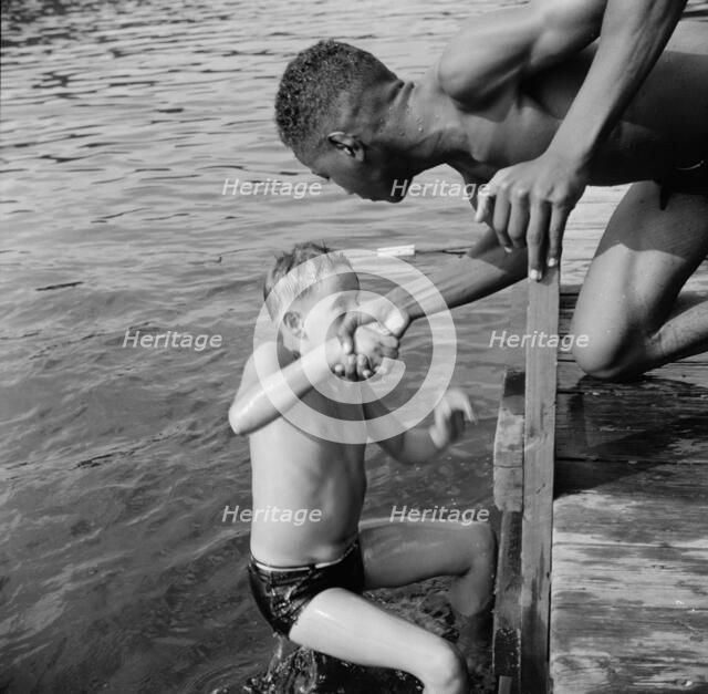 A scene at the swimming dock, Camp Nathan Hale, Southfields, New York, 1943 Creator: Gordon Parks.