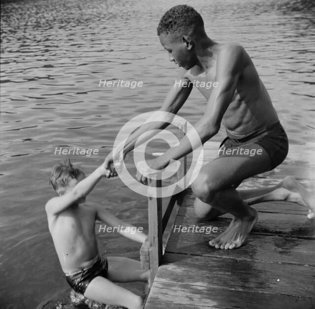A scene at the swimming dock, Camp Nathan Hale, Southfields, New York, 1943 Creator: Gordon Parks.