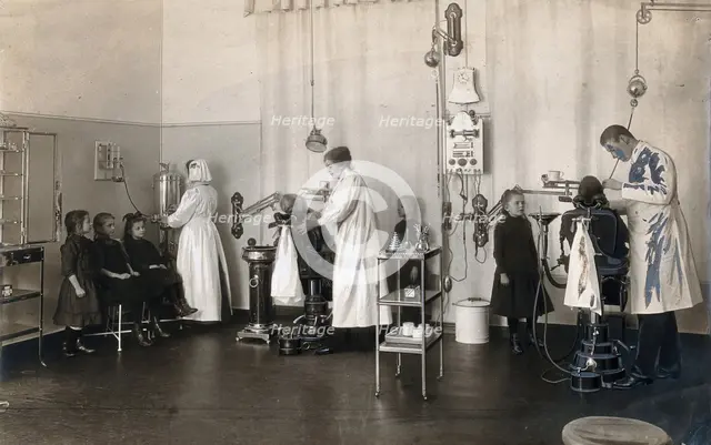 A school-children's dental clinic in Berlin: some children being treated..., c1900. Creator: Unknown.