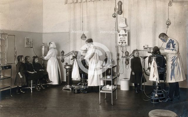 A school-children's dental clinic in Berlin: some children being treated..., c1900. Creator: Unknown.
