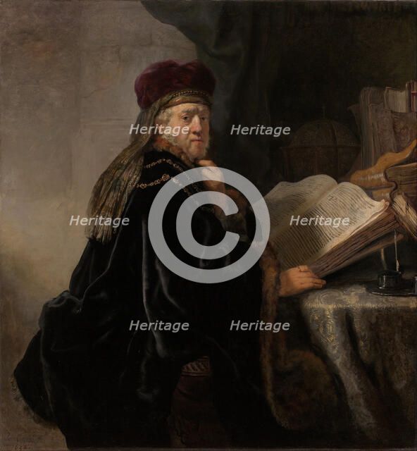 A Scholar Seated at a Desk (Scholar at his Study). Artist: Rembrandt van Rhijn (1606-1669)
