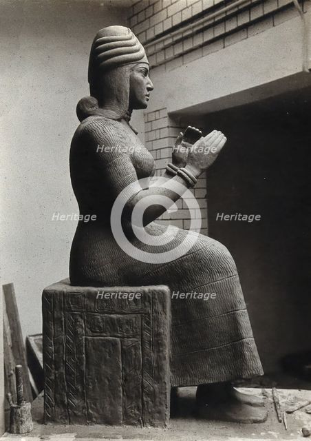 A sculpture of Gula, Mesopotamian deity of healing, with a dog at her side, c1900. Creator: Unknown.