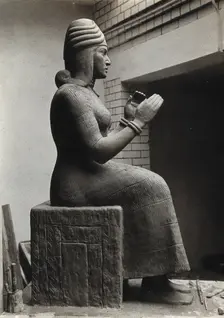 A sculpture of Gula, Mesopotamian deity of healing, with a dog at her side, c1900. Creator: Unknown