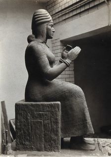 A sculpture of Gula, Mesopotamian deity of healing, with a dog at her side, c1900. Creator: Unknown