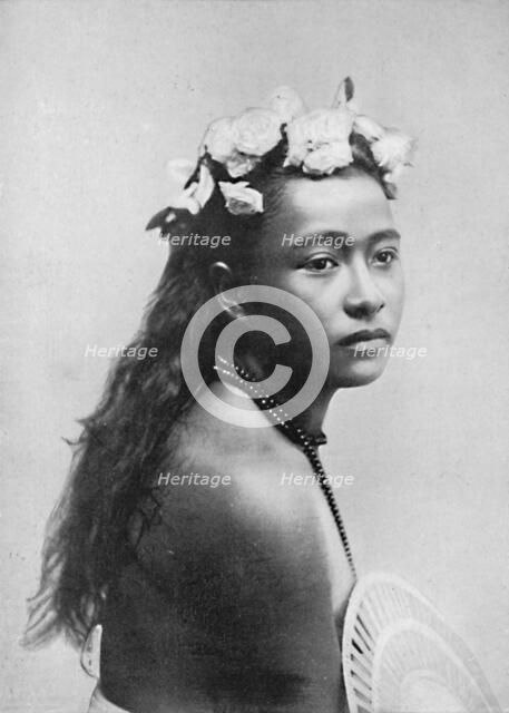 A Samoan girl, with chaplet of hibiscus flowers, 1902. Artist: Thomas Andrew.