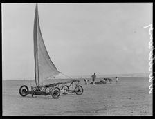 A sand yacht on West Wittering Beach with people digging in the sand, Chichester, West Sussex, 1930s Creator: George R Long