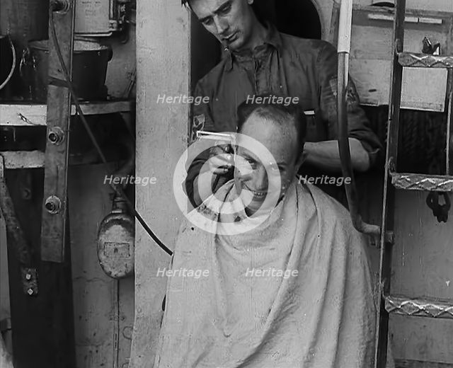 A Sailor Getting his Hair Cut, 1943. Creator: British Pathe Ltd.
