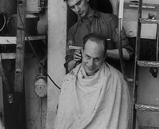 A Sailor Getting his Hair Cut, 1943. Creator: British Pathe Ltd