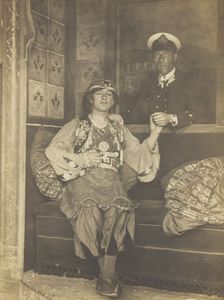 A sailor holds hands with a man in elaborate drag, [between 1910 and 1999?]. Creator: Unknown