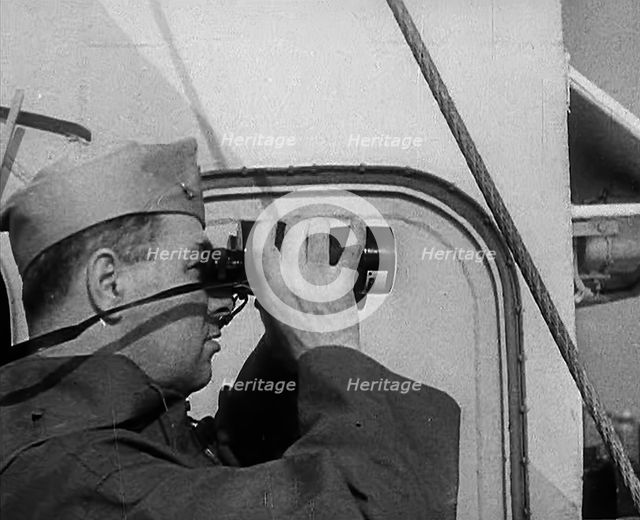 A Sailor Using Binoculars, 1943. Creator: British Pathe Ltd.