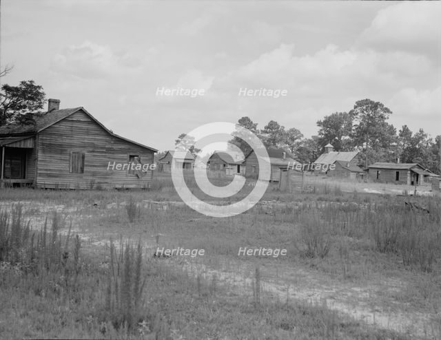 A sawmill village, abandoned after the closing of the mill, Careyville, Florida, 1937. Creator: Dorothea Lange.