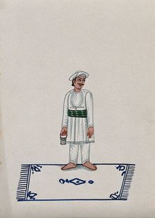 A servant standing on a carpet holding a bunch of keys, (between 1800 and 1899?). Creator: Unknown