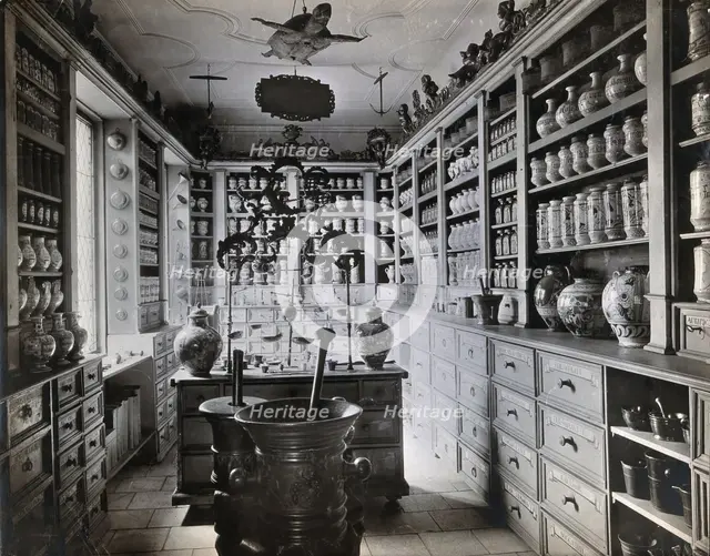A seventeenth-century German apothecary's shop with ornate pharmacy jars..., c1900s. Creator: Christof Muller.
