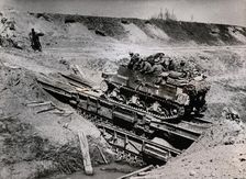 A Sexton SP gun crossing the Senio River, Italy, April 1945