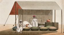 A shopkeeping weighing grains for a customer, (between 1800 and 1899?). Creator: Unknown