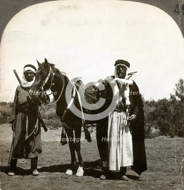 A sheikh and his bodyguard, Syria, 1900s.Artist: Keystone