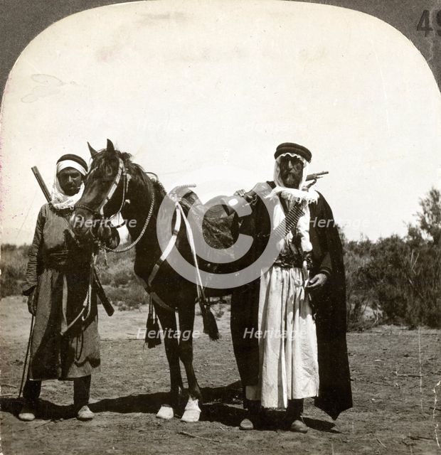 A sheikh and his bodyguard, Syria, 1900s.Artist: Keystone