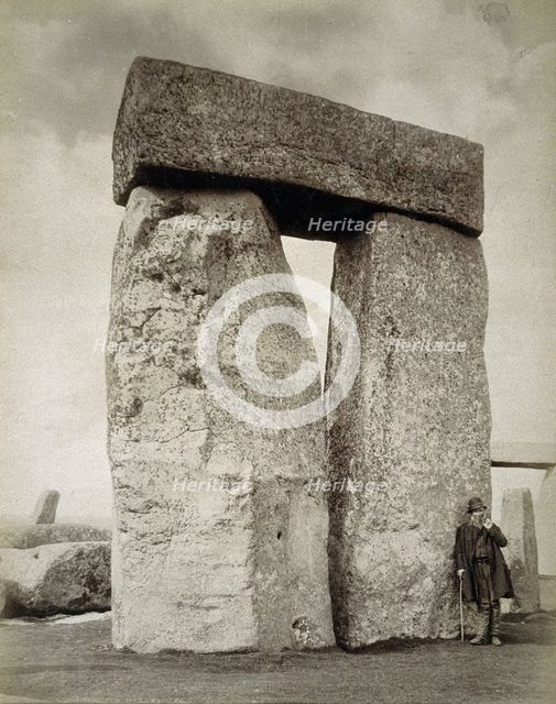 A shepherd posing at Stonehenge on Salisbury Plain, Wiltshire, 19th century. Creator: Unknown.