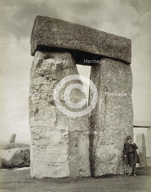 A shepherd posing at Stonehenge on Salisbury Plain, Wiltshire, 19th century. Artist: Unknown