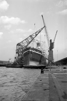 A ship moored in London docks, 1937. Artist: SW Rawlings