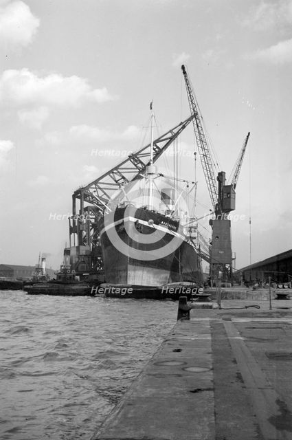 A ship moored in London docks, 1937. Artist: SW Rawlings
