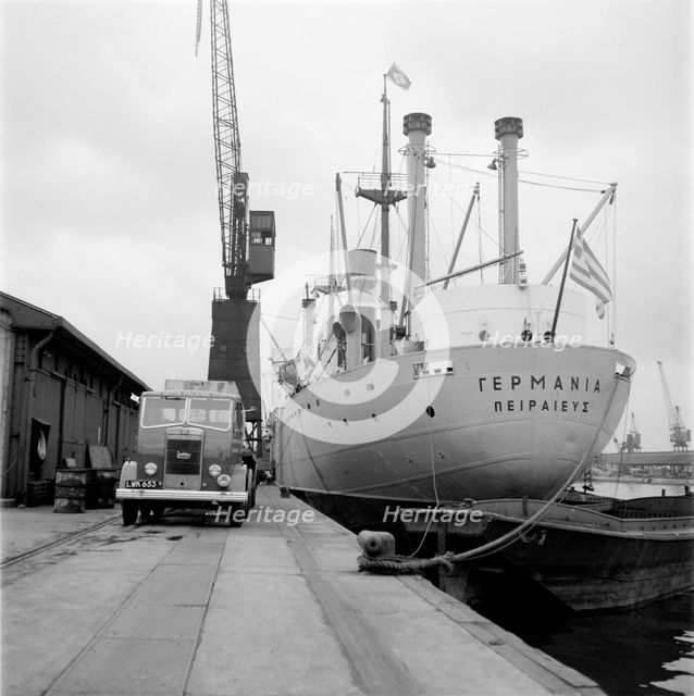 A ship unloading in West India Docks, London, c1945-c1965. Artist: SW Rawlings