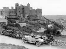 A Singer car in front of Harlech Castle, Wales, early 1920s