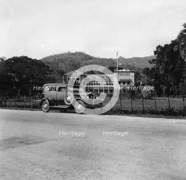 A Singer car in front of the Governor's house, Trinidad, Trinidad and Tobago, 1931 Artist: Unknown