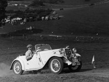 A Singer Nine Le Mans climbing a hill, 1935