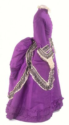 A side view of a fashionable day dress, c1875. Creator: Unknown