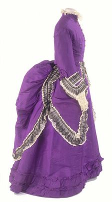 A side view of a fashionable day dress, c1875