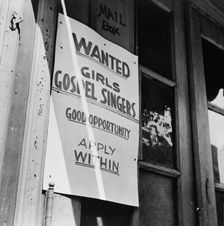 A sign in the Harlem section, New York, 1943. Creator: Gordon Parks