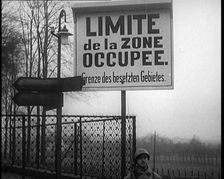 A Sign Read Limite de la Zone Occupee. Grenze des Besetzten Gebietes a French Soldier..., 1924. Creator: British Pathe Ltd