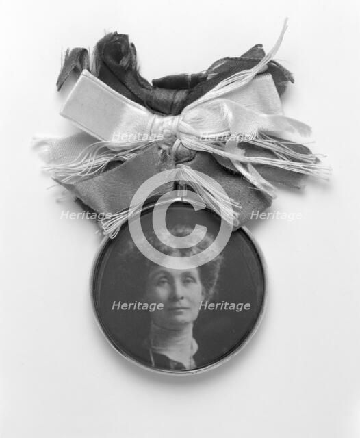 A silver and glass badge with a medallion portrait of Emmeline Pankhurst, c1908. Artist: Unknown