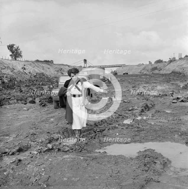 A site nurse at Section B3 of the London to Yorkshire Motorway (the M1), Milton Keynes, 09/1958. Creator: John Laing plc.