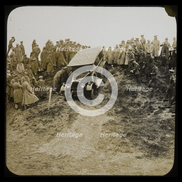 A six-wheeled car, possibly an early Morris Commercial 6x4, driving down a slope..., 1926-1929.  Creator: Norman Kingsley Harrison.